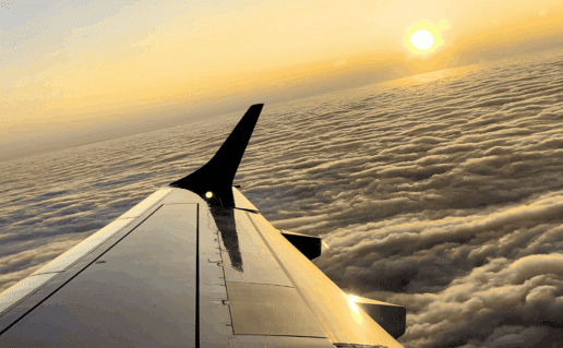 Air plane wing over the horizon