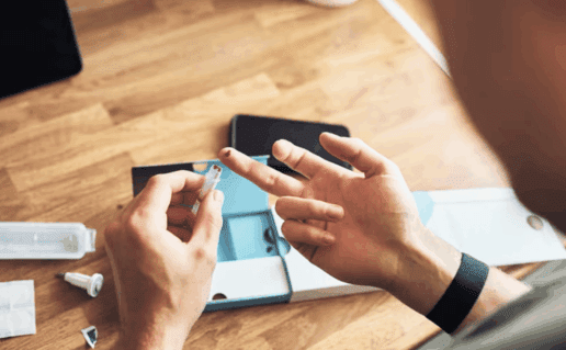 Guy using at-home HIV testing kit