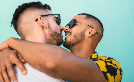 Two men hugging, dating with HIV